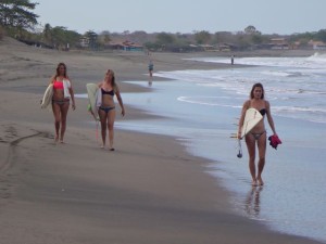 Women surfing in Miramar, Nicaragua