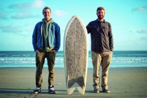 Ben Judkins and Taylor Lane with the Cigarette Surfboard